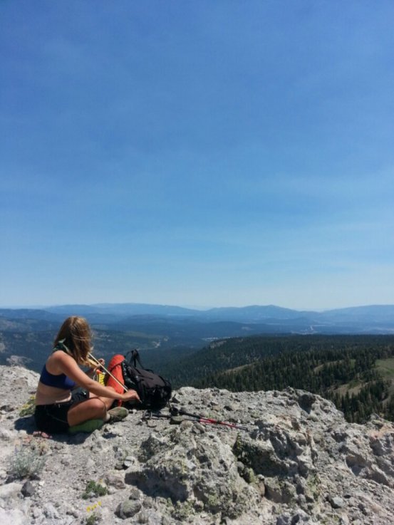 Instigate plays her violin on a ridge in Northern California on the PCT. 2013