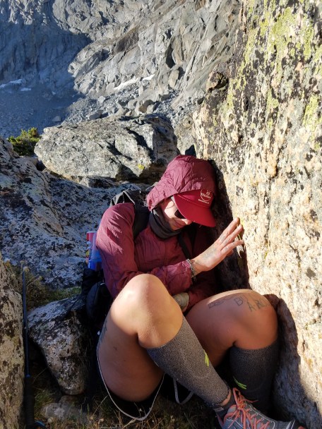 Lia hides from the wind